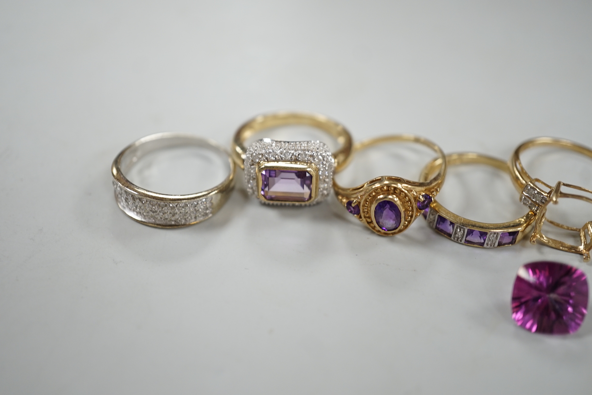 Five assorted modern 9ct gold and gem set dress rings, including diamond chip half hoop and amethyst and diamond chip half hoop, gross weight 12.6 grams.